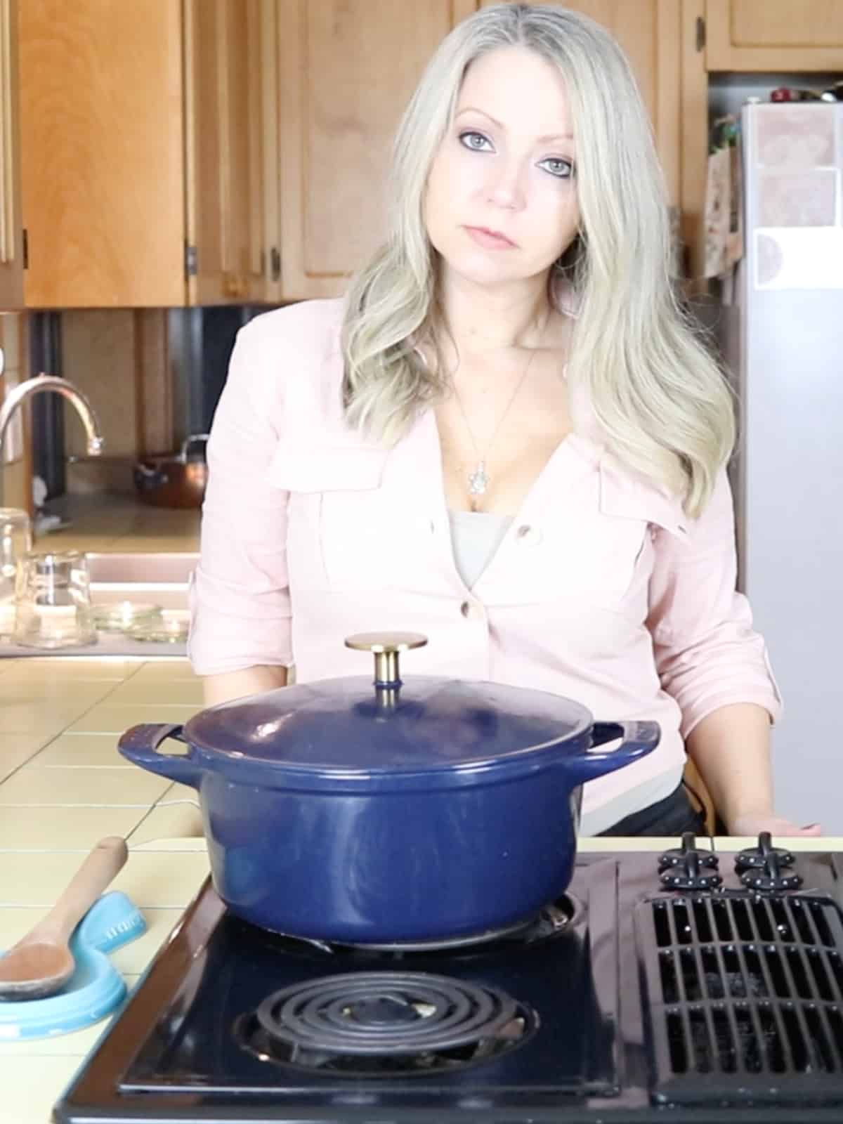 a mom standing at the stove