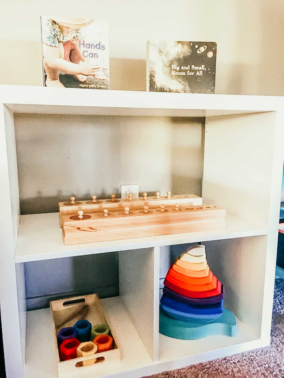 Open Shelves with Montessori materials, books, and toddler toys