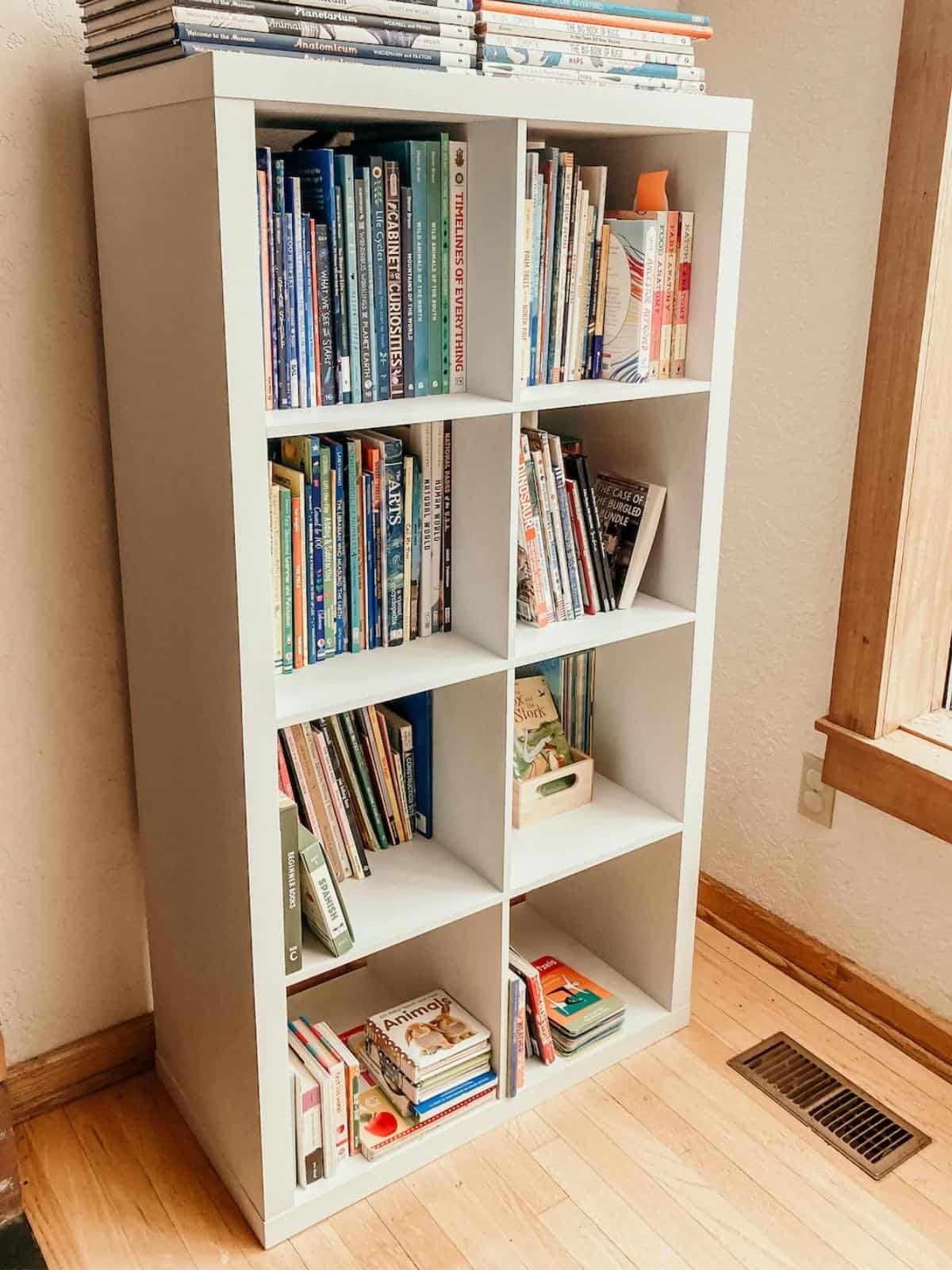 Montessori bookshelf with books and eight cubes