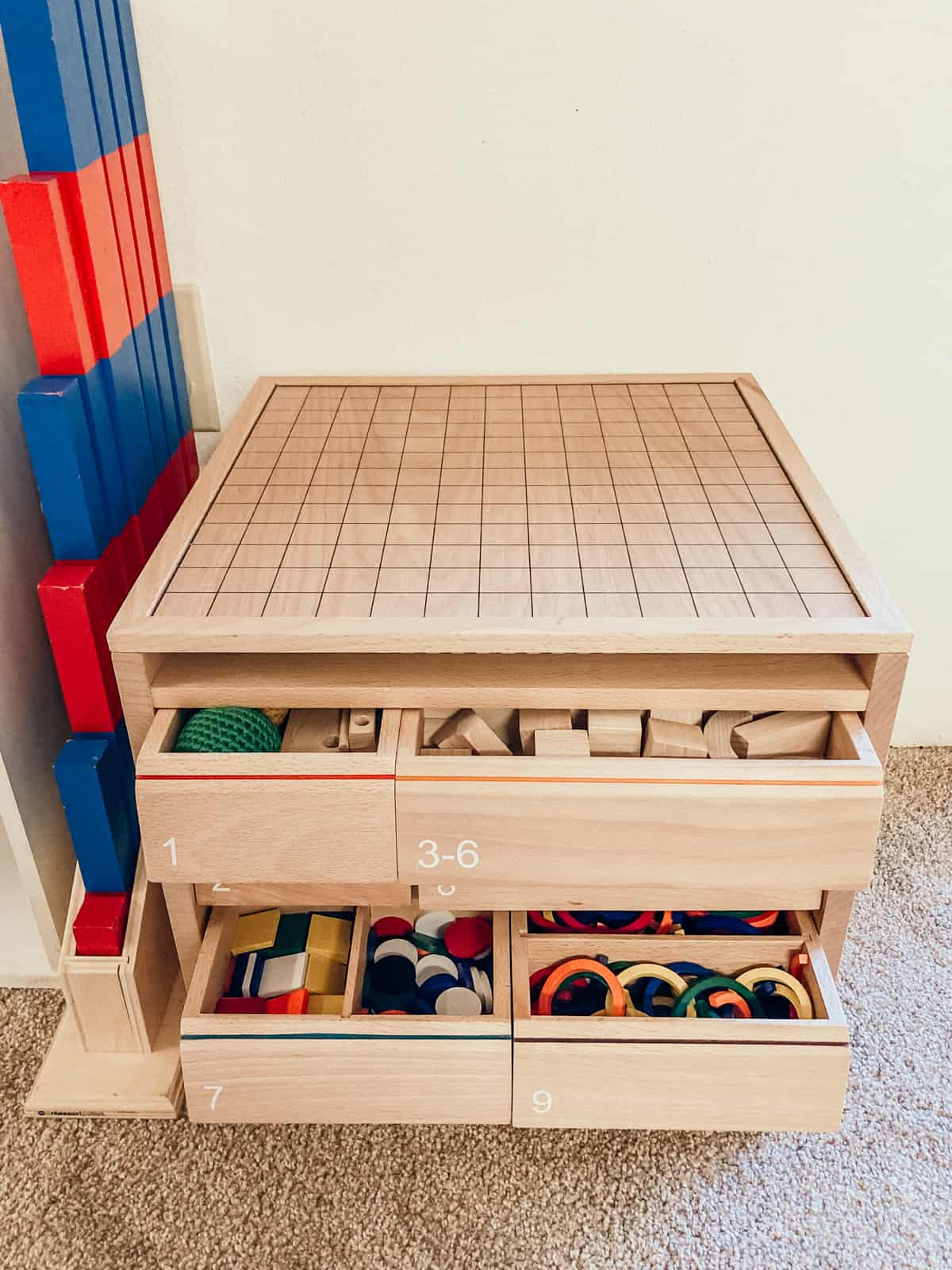 spielgaben with drawers open and manipulatives showing in a preschool and kindergarten homeschool room