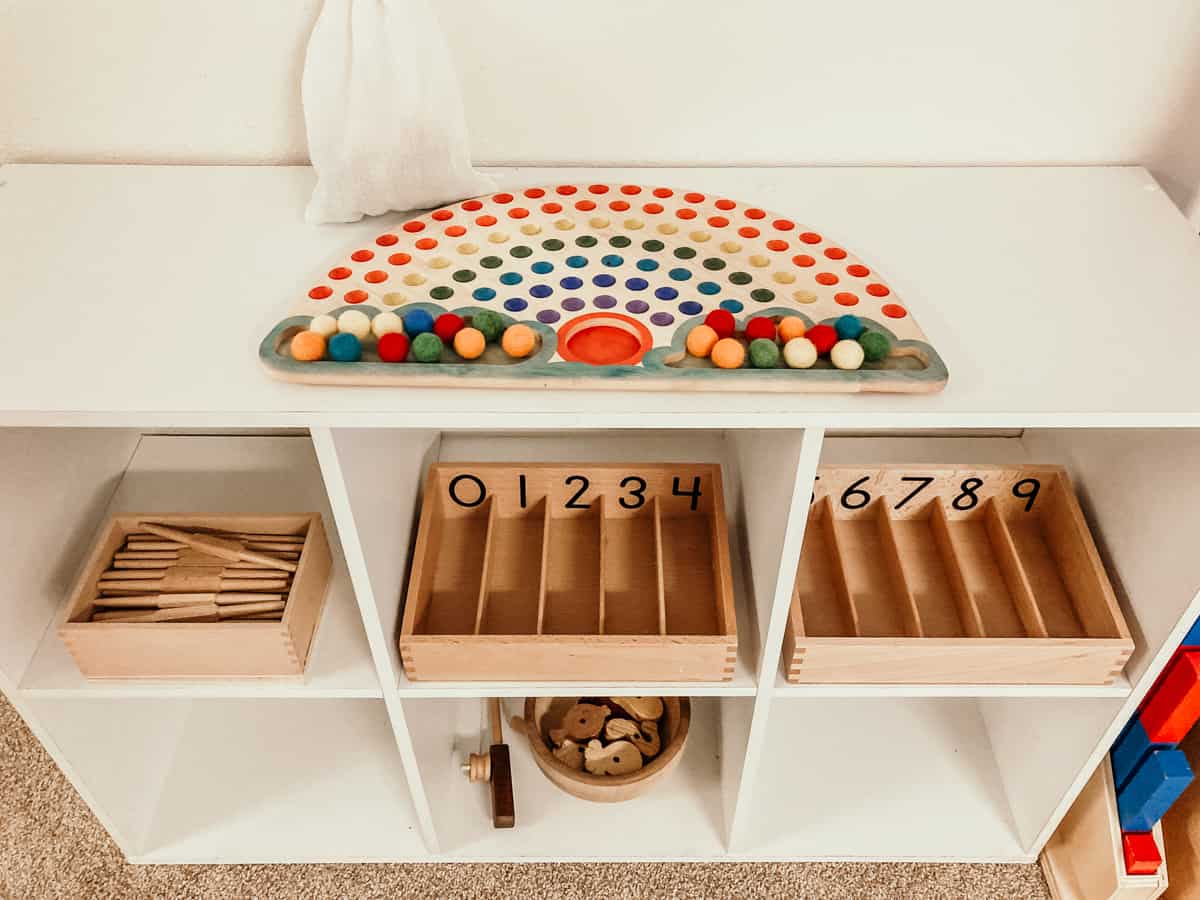 toddler shelves with color sorting and math materials