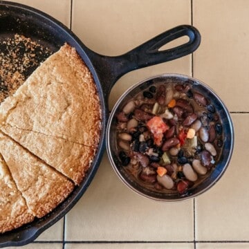 three sisters beans stew next to a pan of einkorn cornbread