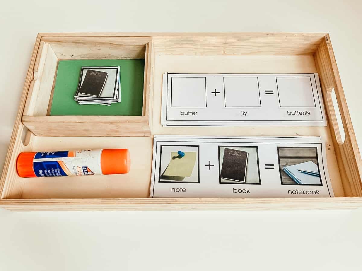 wooden tray with image cards and a glue stick for exploring history of language through word study