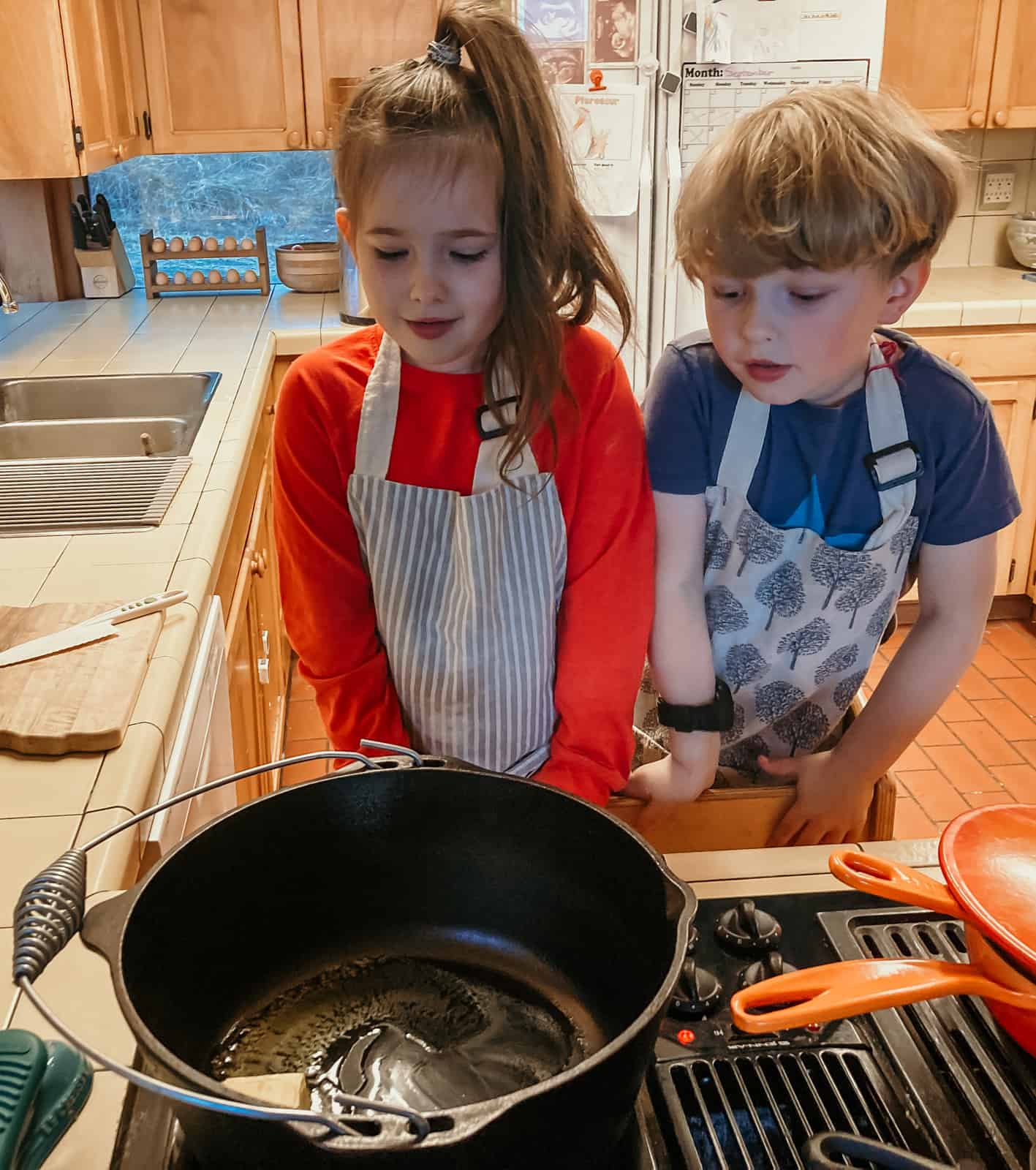 kids watching butter melt in a dutch oven