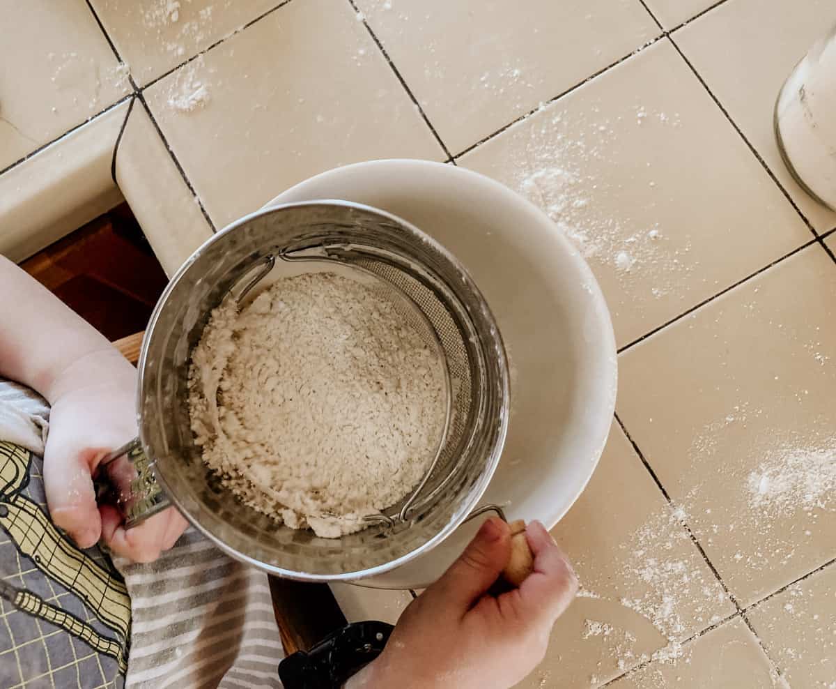 einkorn flour in a sifter