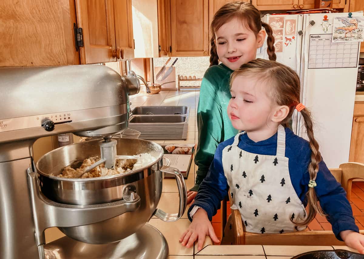 kids watching a stand mixer do its thing