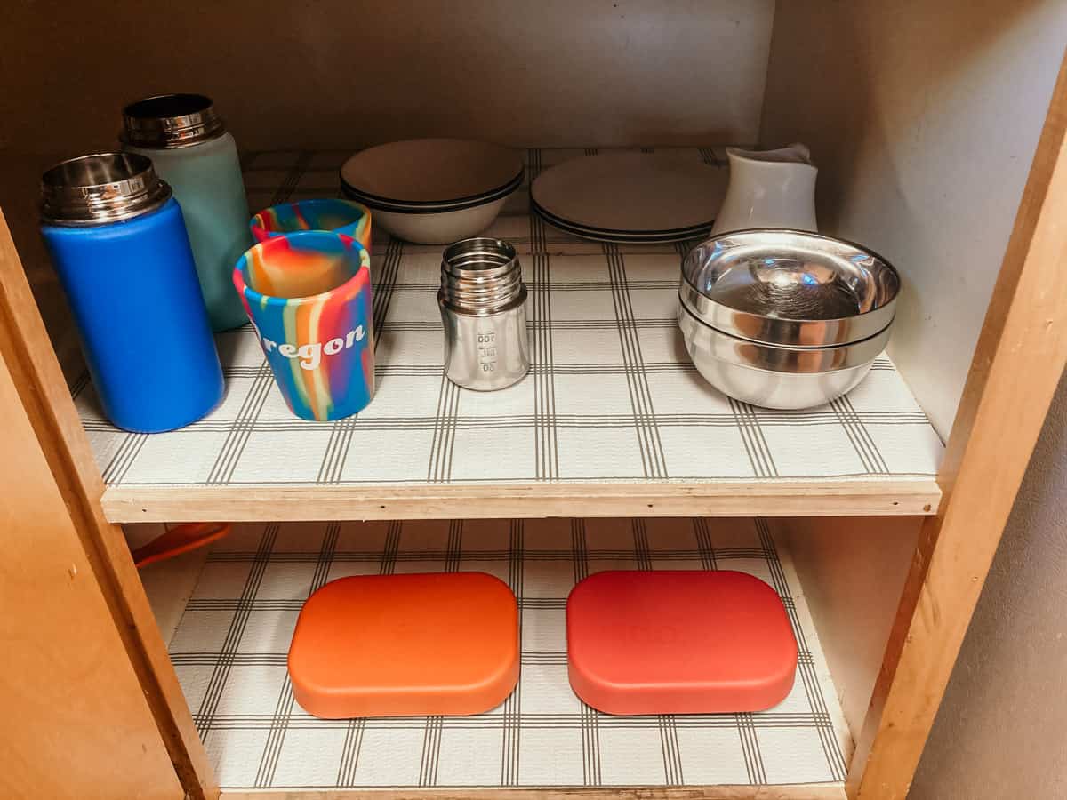 low kitchen shelving for kids' cups, plates, bowls, and more