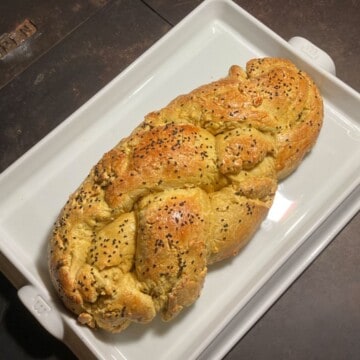freshly baked Turmeric and Nigella Seed Easter Bread on a Made In baking slab