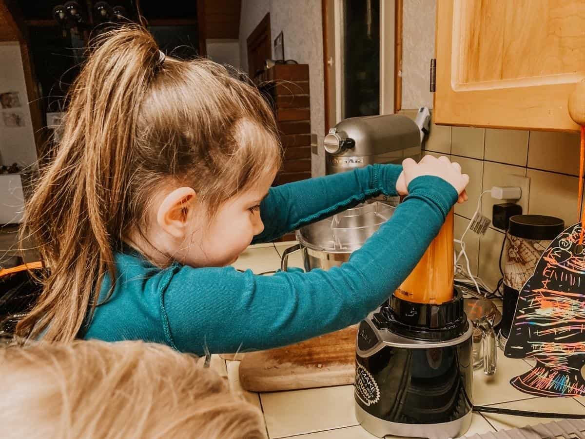 child using a blender