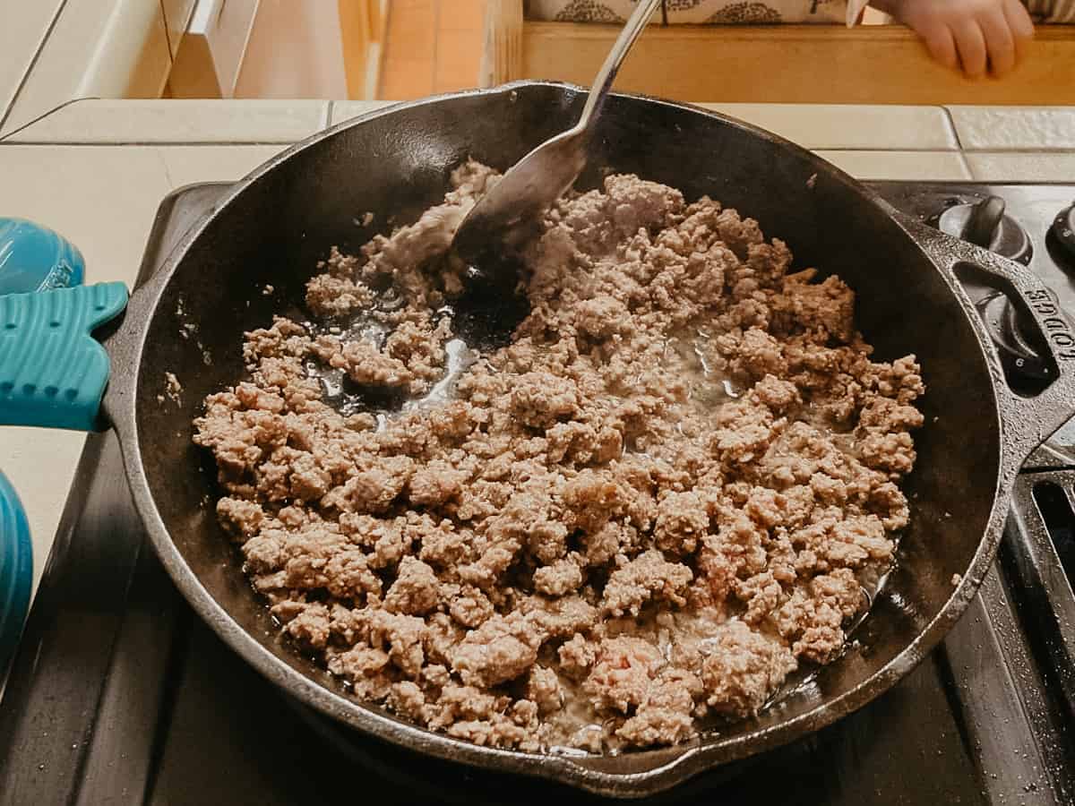 kids cooking and stirring ground beef