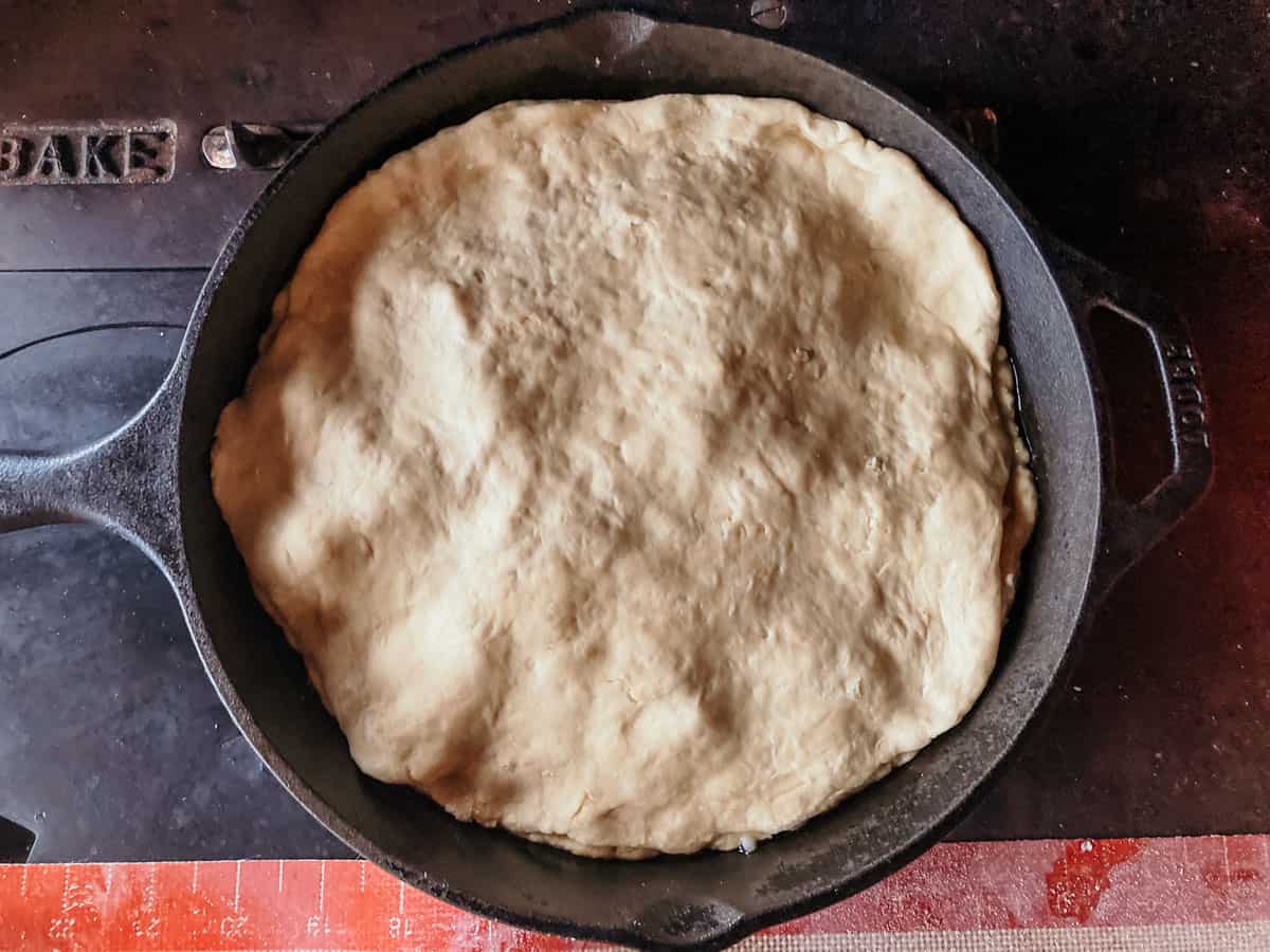 view of the top layer of dough of an Argentine stuffed crust pizza