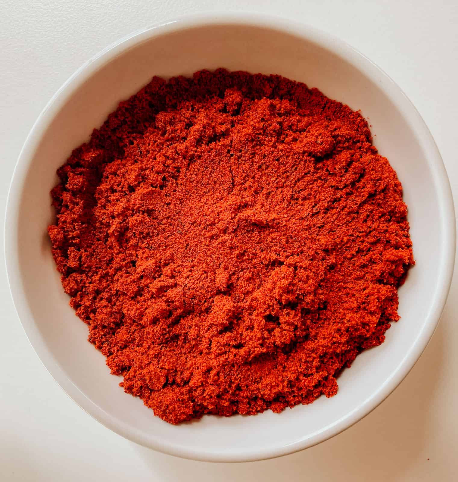 closeup of ground achiote molido in a bowl