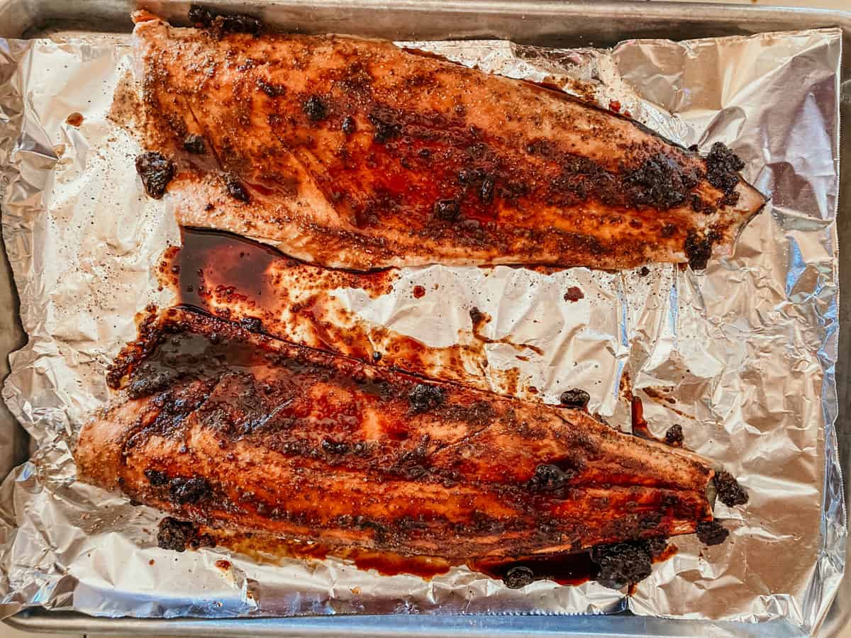 whiskey and sweet tea glazed salmon on a sheet pan with aluminum foil