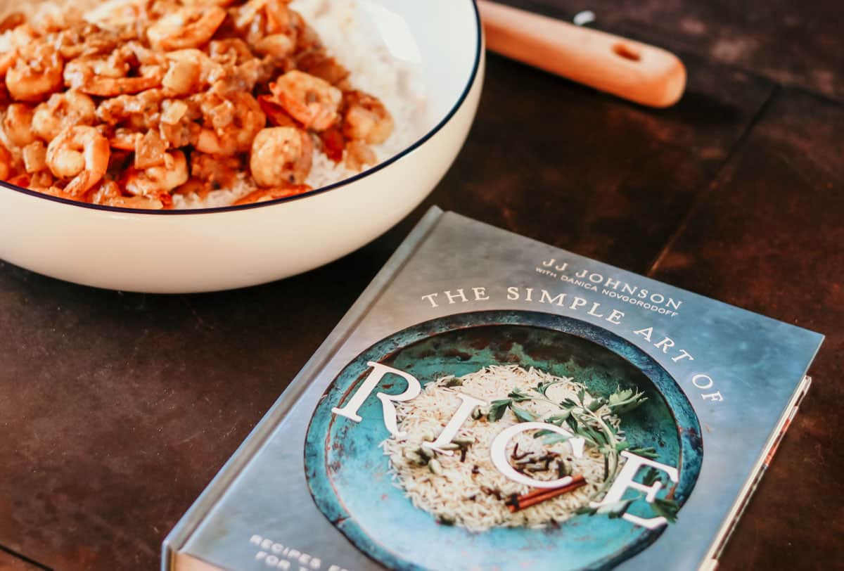 the simple art of rice cookbook and a bowl of persian-style shrimp and rice