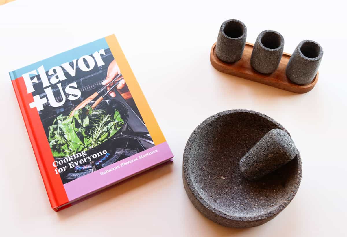Flavor Plus Us cookbook, a molcajete, tejolote, and tequileros
