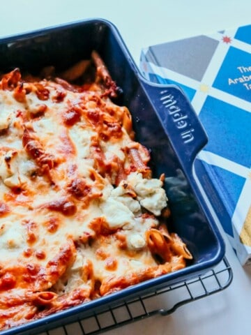 Goat Cheese Pasta Bake in a Rectangular Baking Dish and The Arabesque Table Cookbook