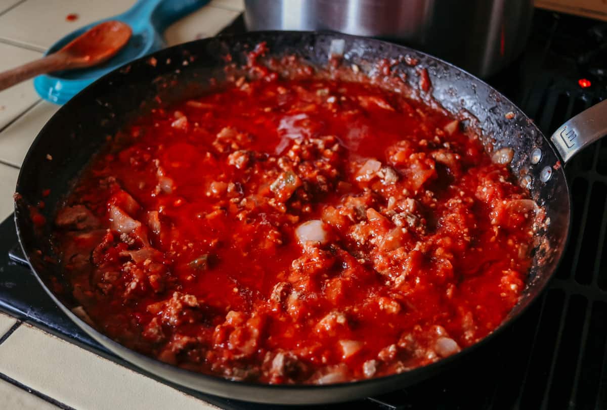 pasta sauce cooking in a carbon steel pan