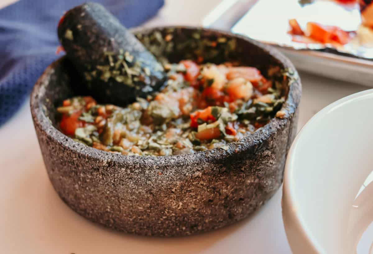 closeup of a molcajete made from volcanic rock