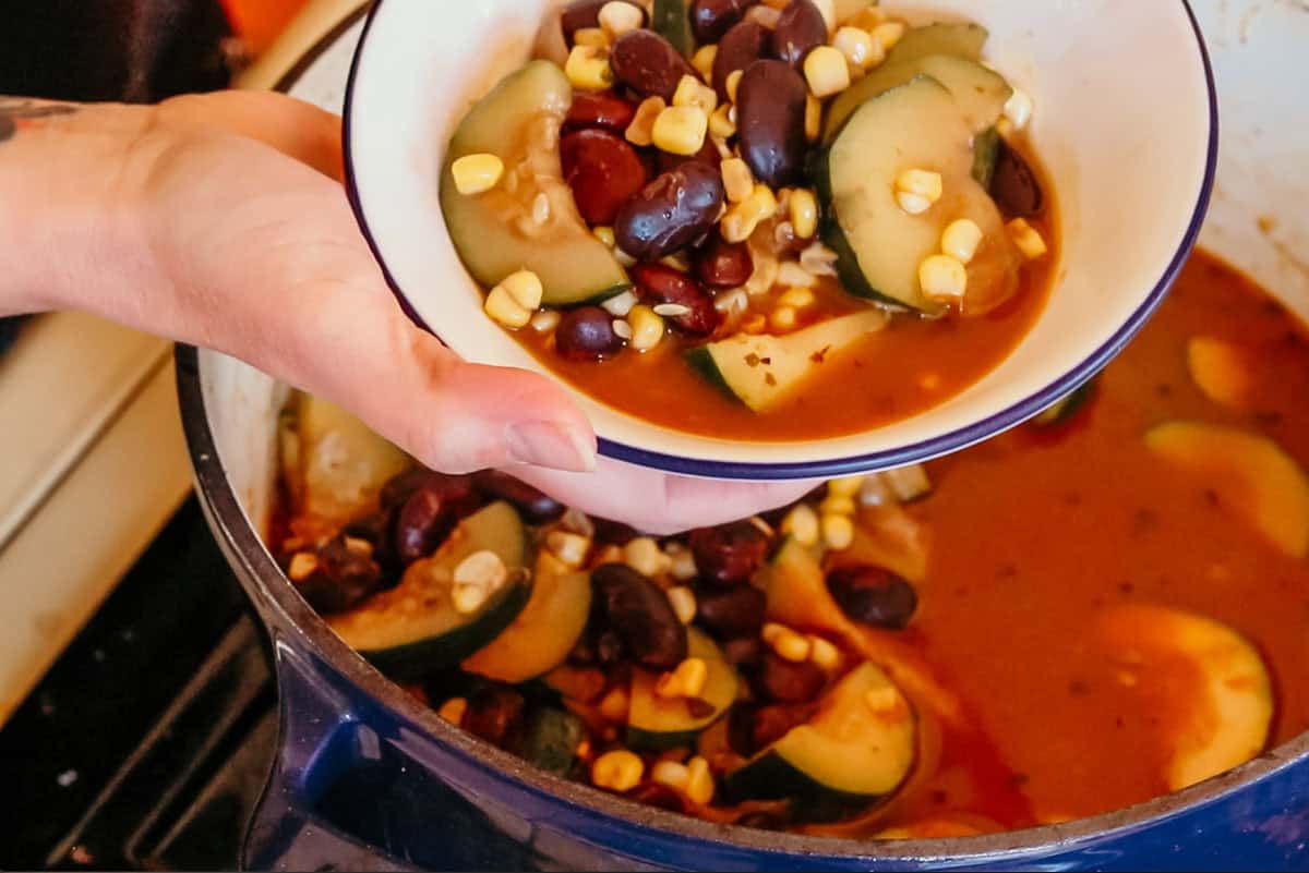 chili sin carne in a bowl and Dutch oven