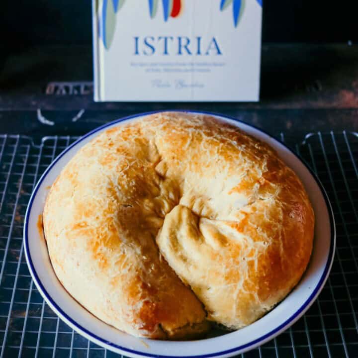 potica or putizza yeasted spiral cake and Istria cookbook in the background