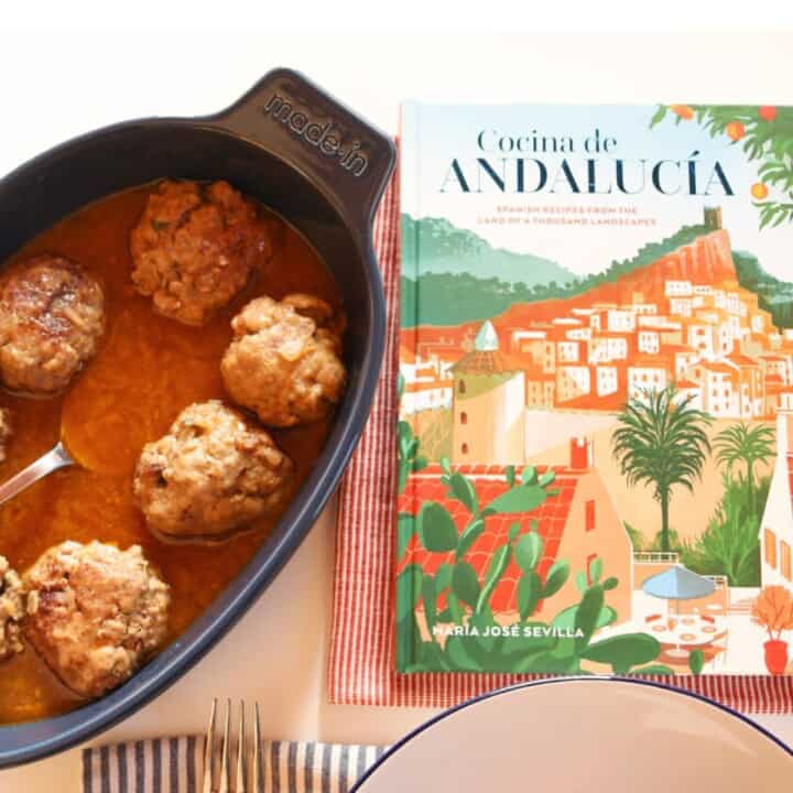 Spanish meatballs in a blonde sauce beside Cocina de Andalucia