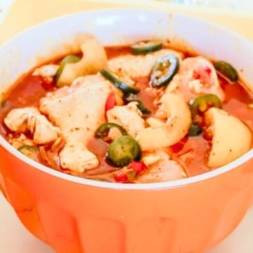 chicken drumsticks in a bowl of barbecue marinade