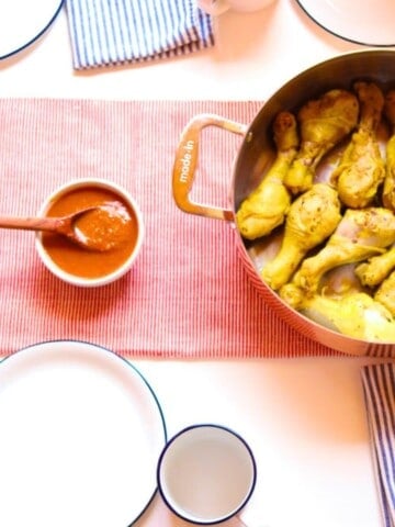 barbecue sauce and drumsticks on a kid's table