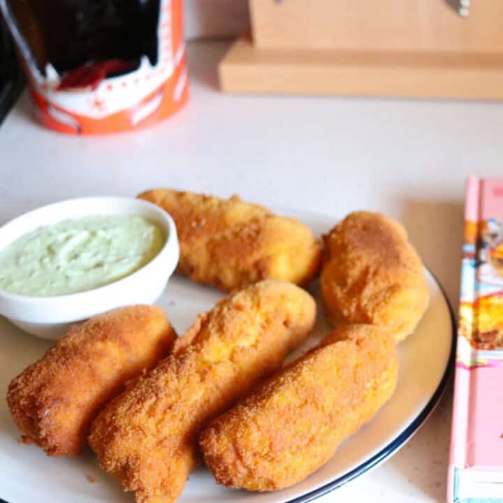 piroshki on a plate with feta sauce
