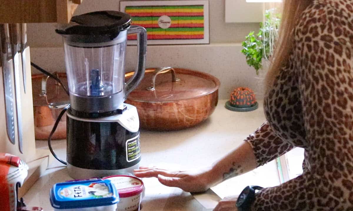 using a chefs knife to smash garlic