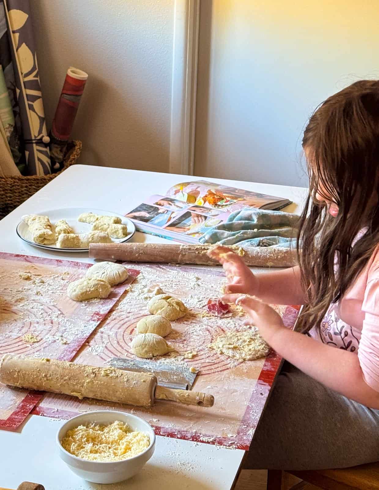 the kids are working with piroshki dough
