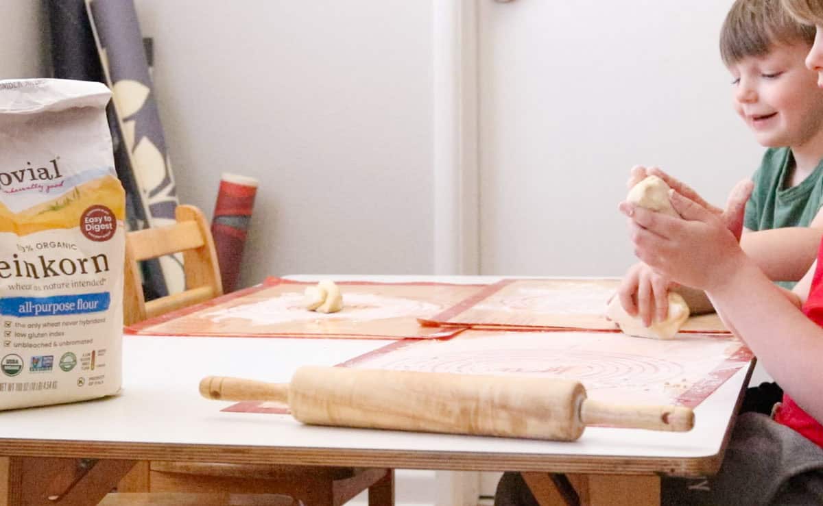 John and Noah are playing with dough and kneading
