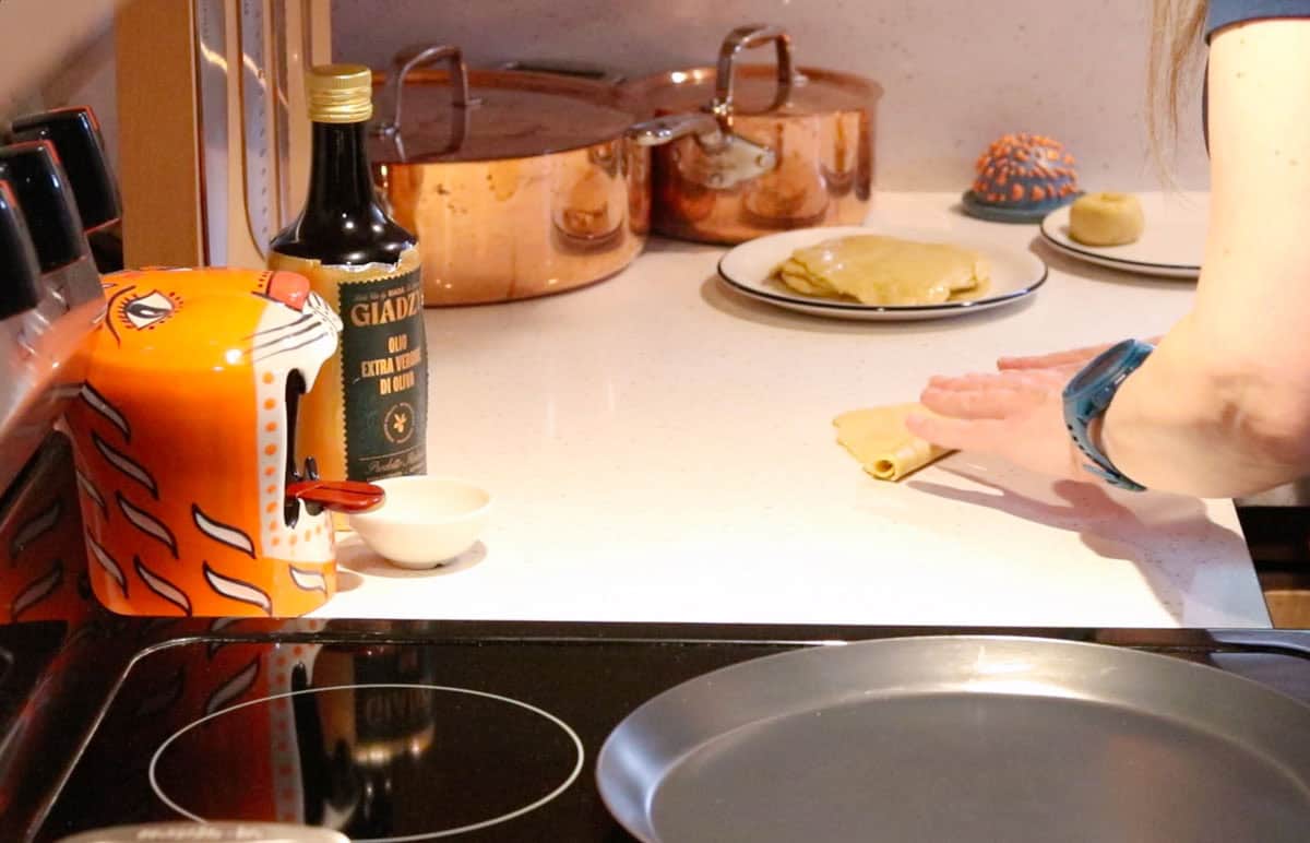 rolling up the parathas dough into a tube