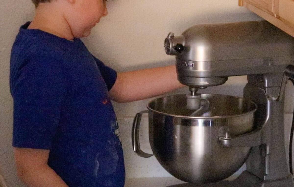 adjusting the mixing speed on the stand mixer