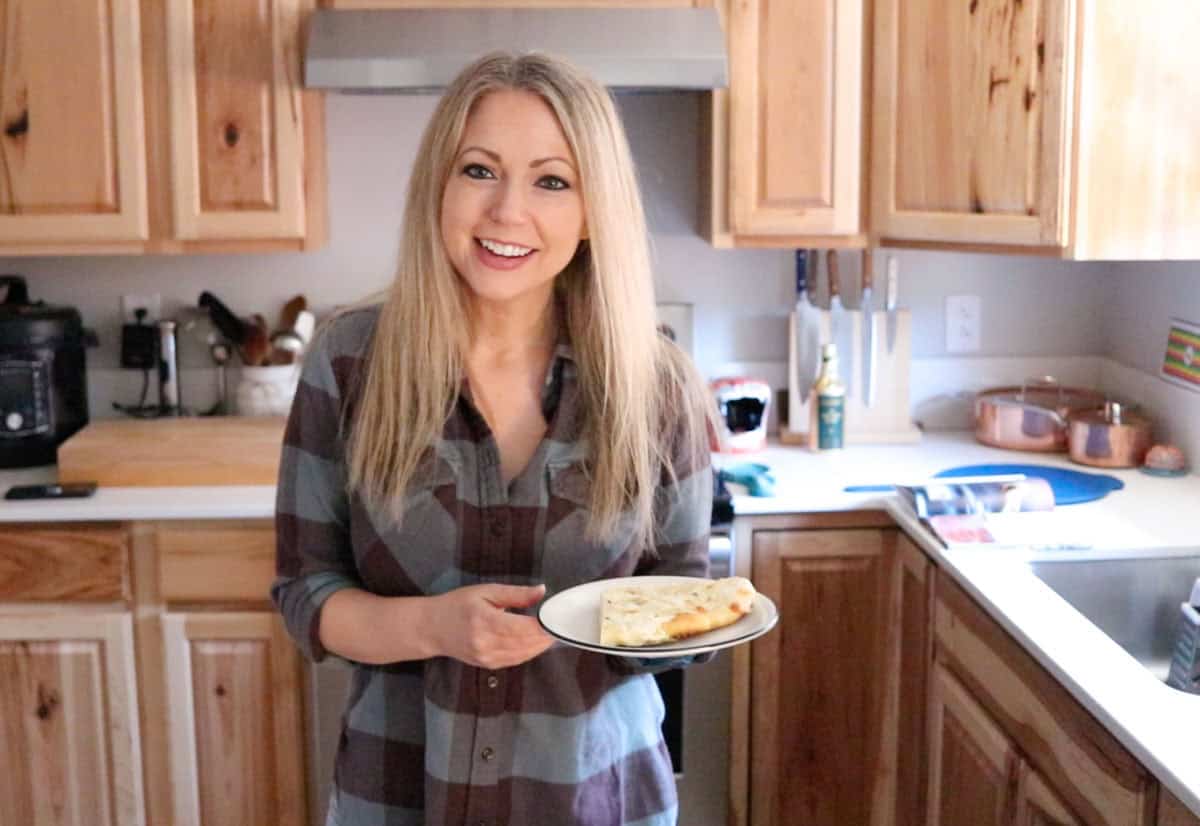 Kristin is holding a slice of white pie