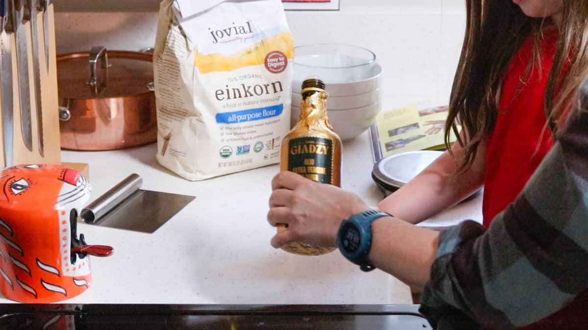 pouring evoo on a clean countertop