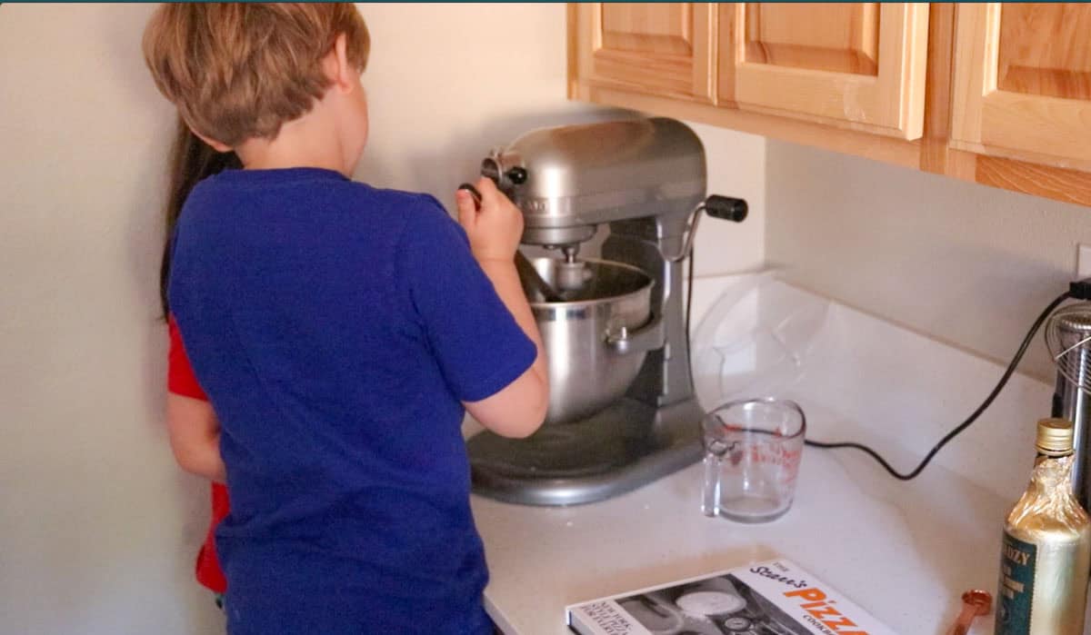 scraping the sides of the mixing bowl