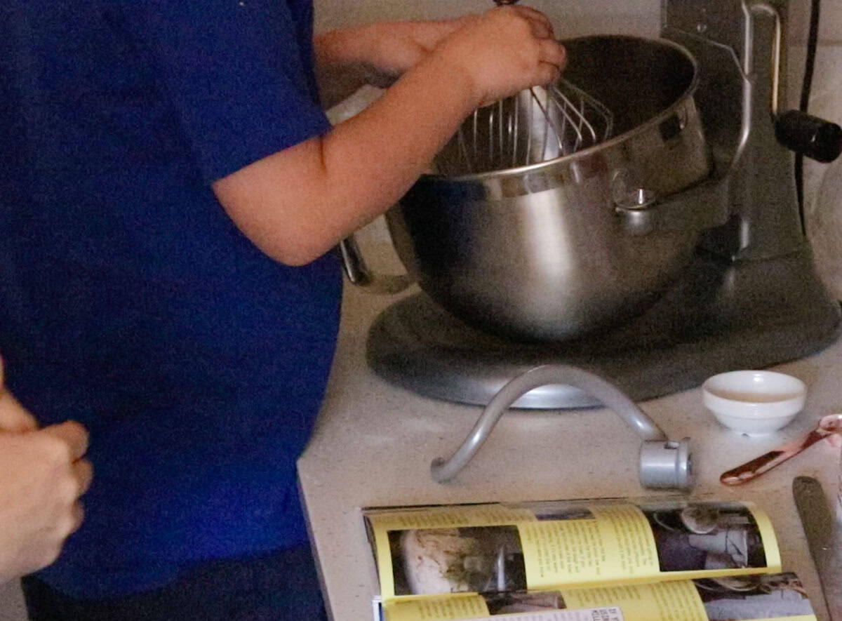 placing whisk attachment on the stand mixer
