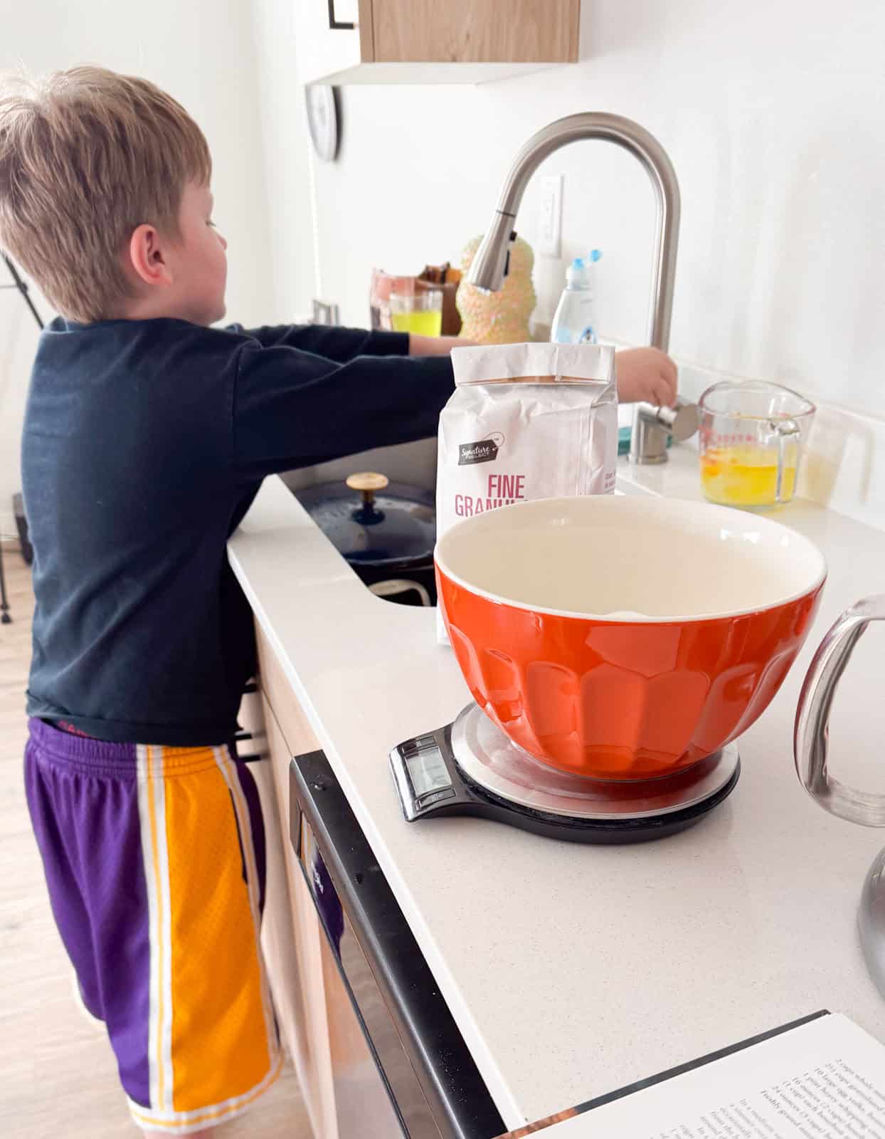 Noah is washing his hands after separating egg yolks