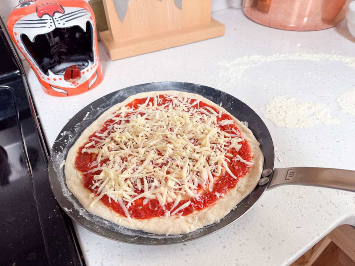 unbaked pizza on a tawa