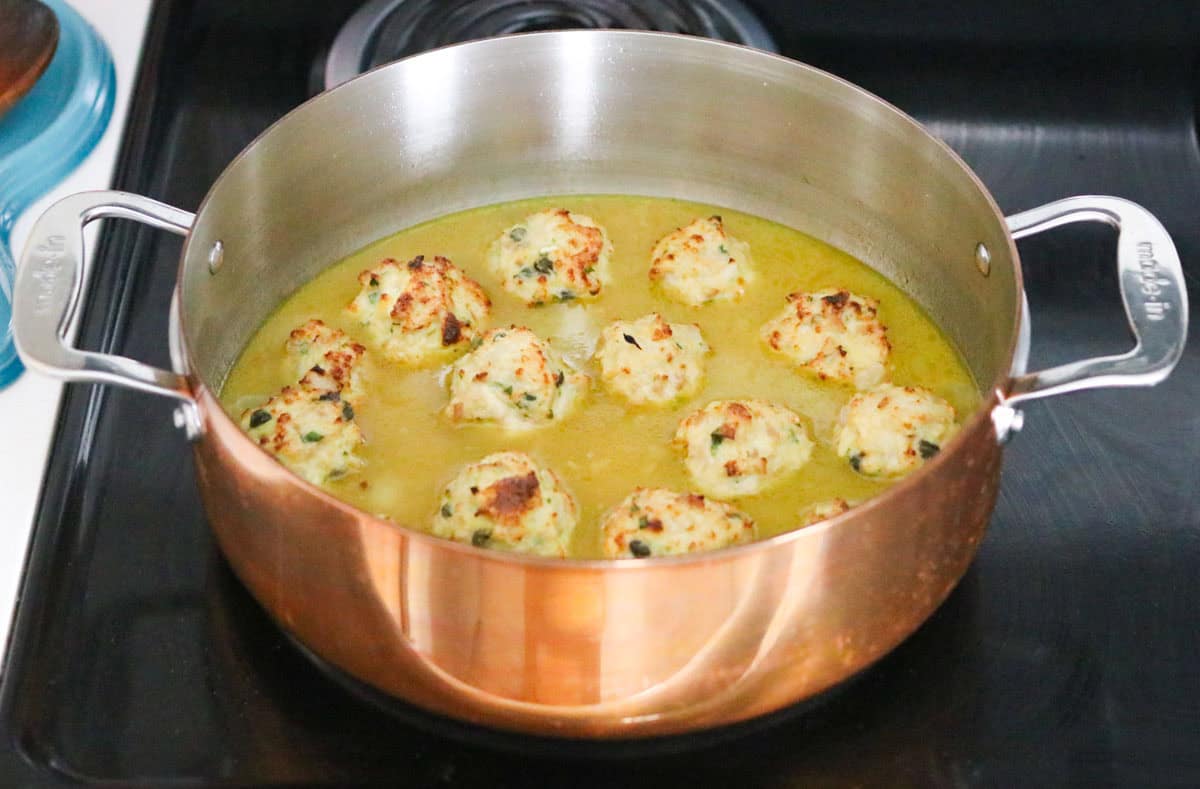 chicken piccata meatballs in a copper rondeau