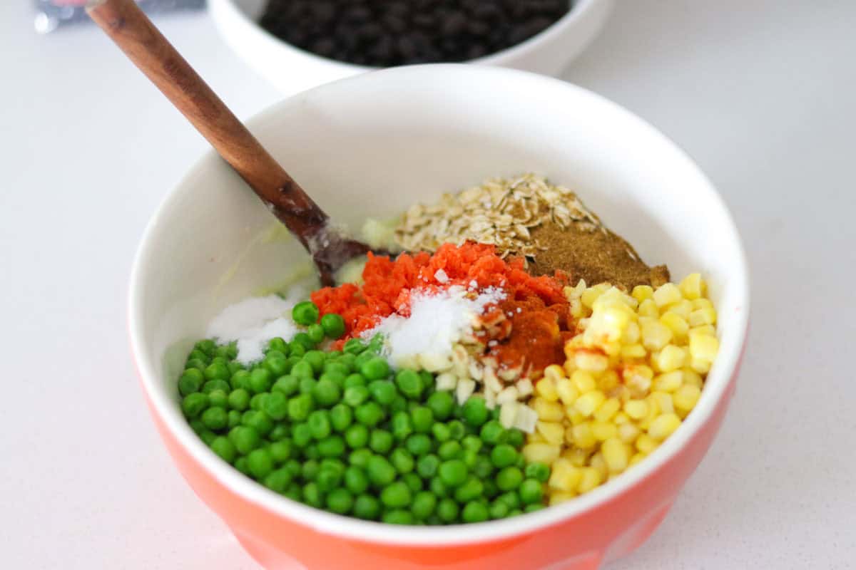 ingredients and spices in a bowl for making veggie burgers