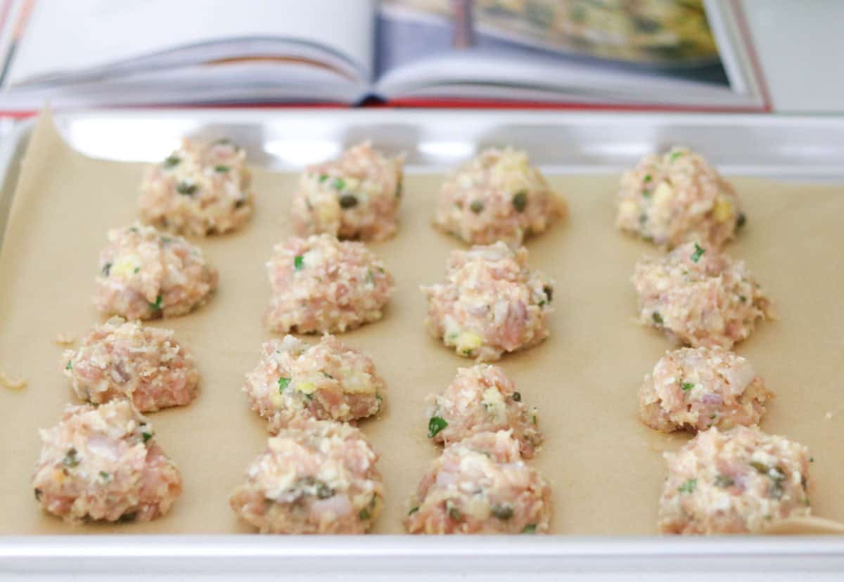 raw ground chicken meatballs with egg, capers, and shallot