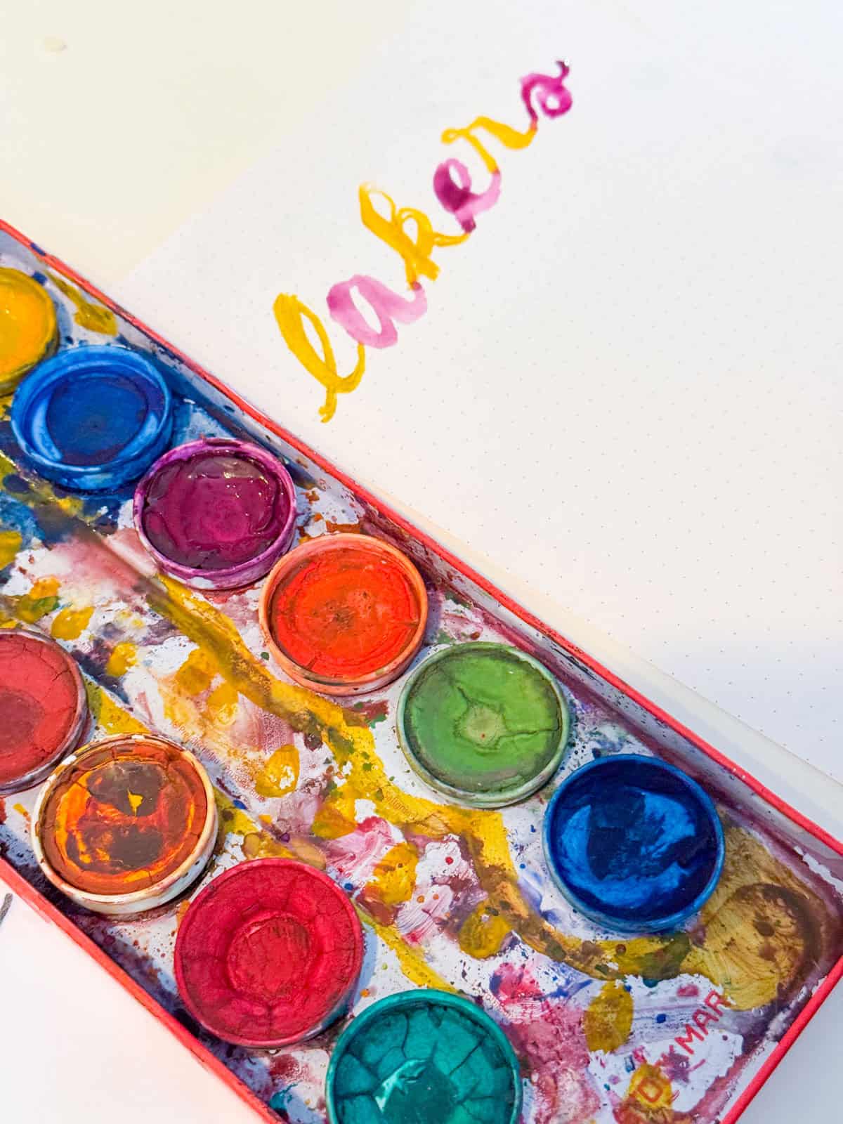 Kaia's hand lettering: lakers in purple and gold