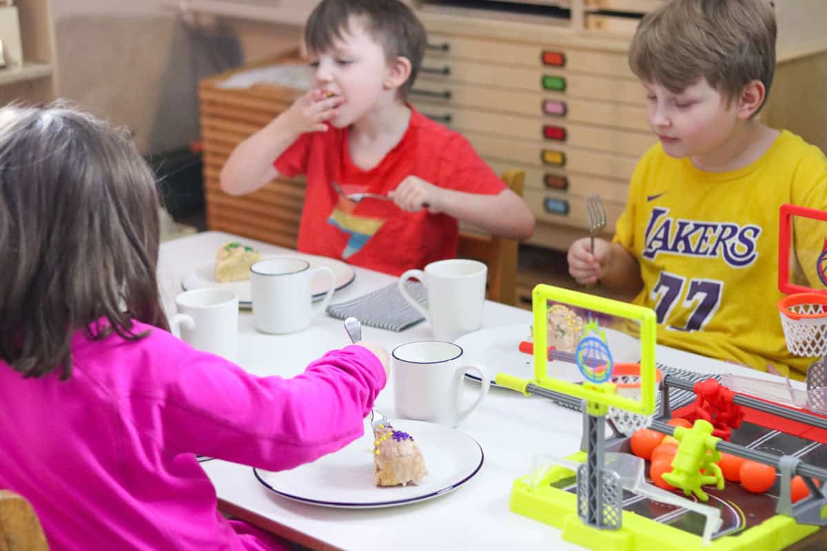 the kids are eating King Cake