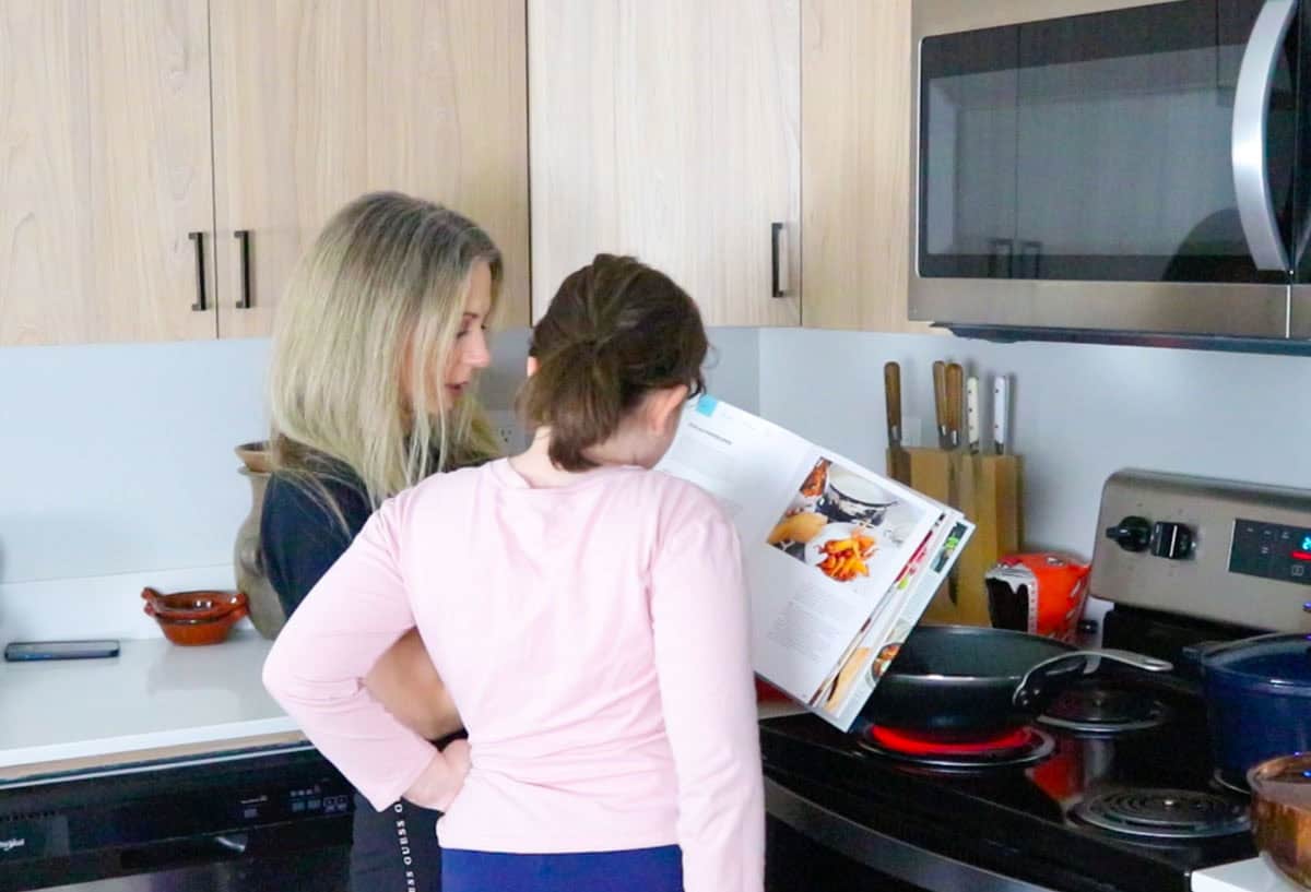 Kristin and Kaia are reviewing the steps for making JoJo-Ala Chicken Wings