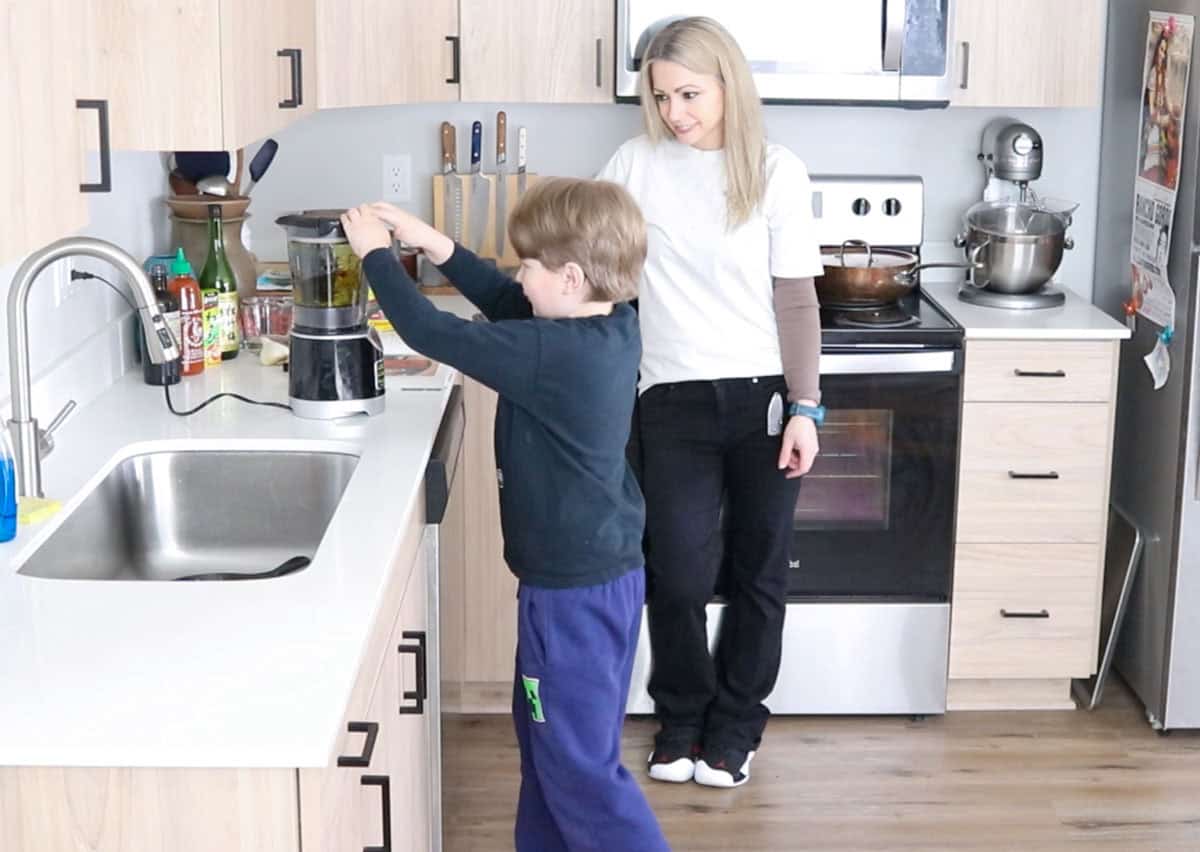 Noah is blending nori sauce in a blender