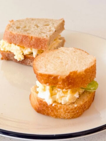 tangy egg salad sandwiches on 2 different types of bread