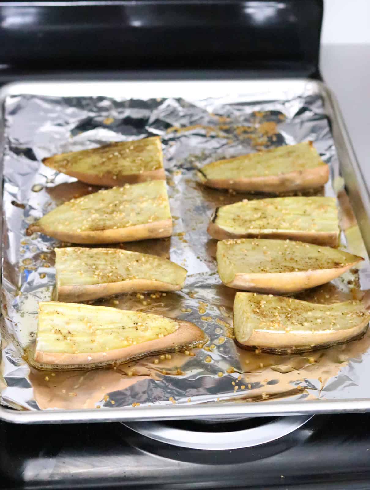 roasted sesame sweet potatoes on a sheet pan