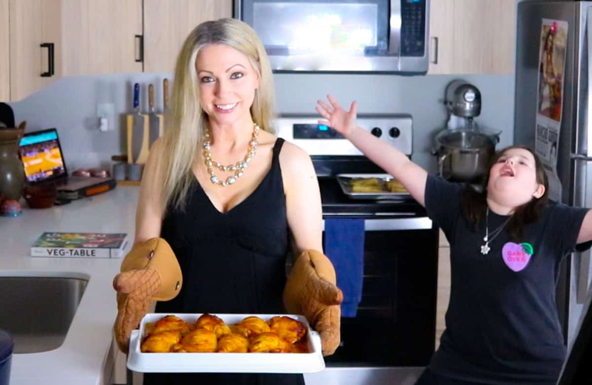 Kristin is serving gochujang chicken and Kaia is excited about it