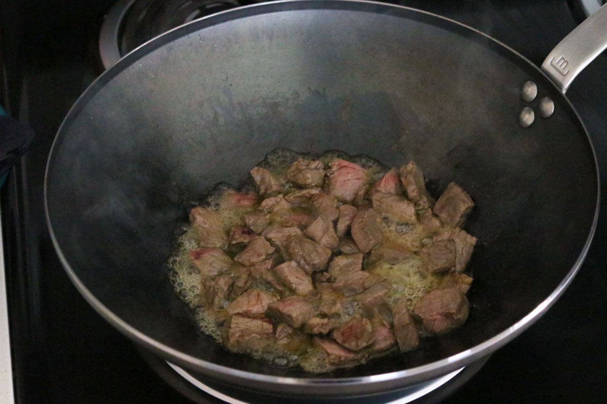 beef shoulder frying in a wok